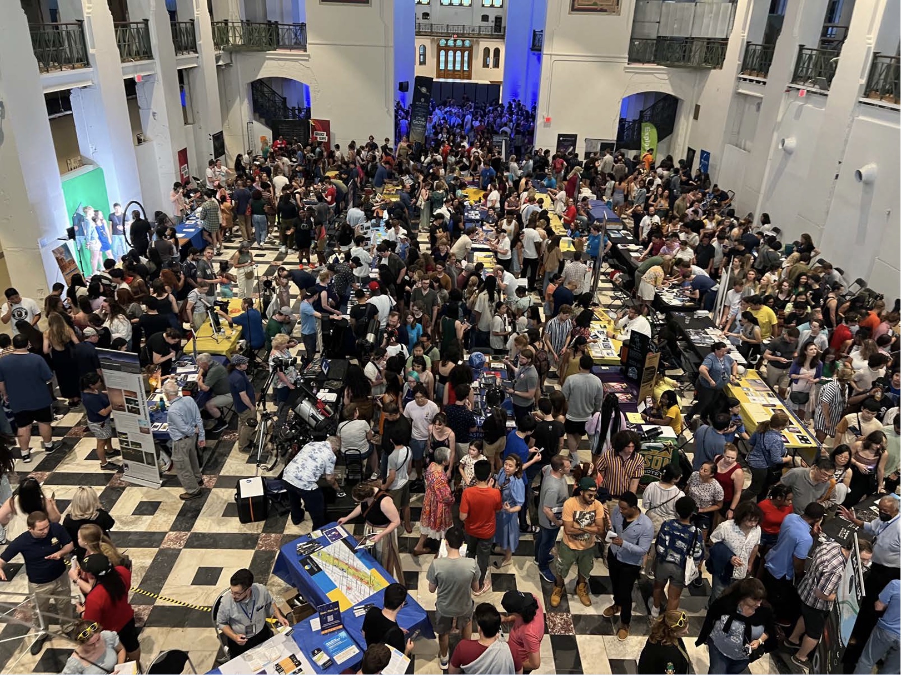 crowds of people indoors for the astronomy festival on the national mall